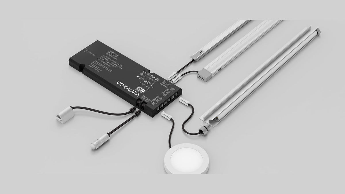 VoxAura integrated driver connected to several compatible furniture lights and a wired switch.